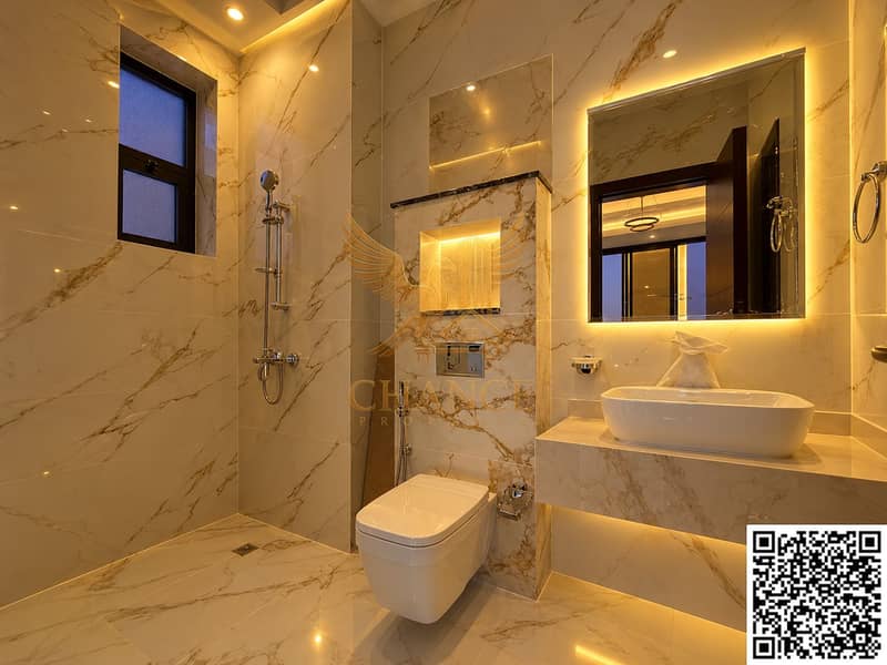 11 Warm Marble Luxury Bathroom with Backlit Vanity. png