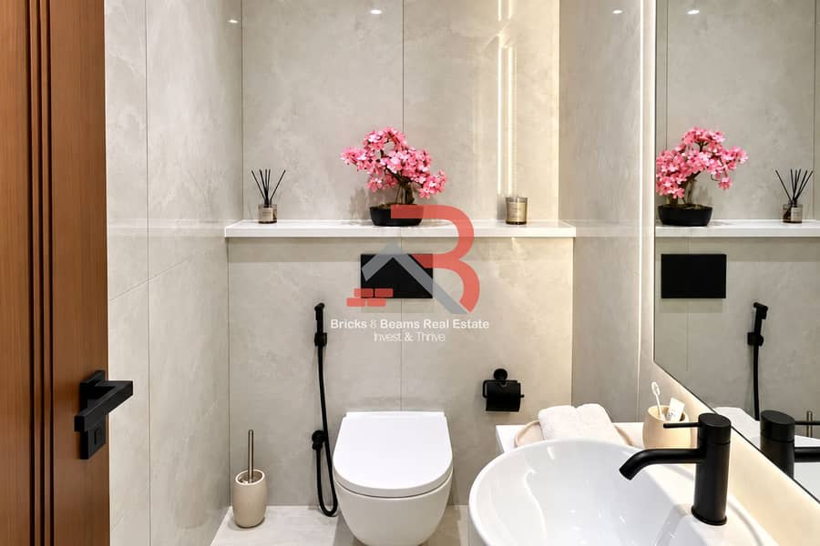 9 Modern Marble Bathroom with Pink Blossoms. png
