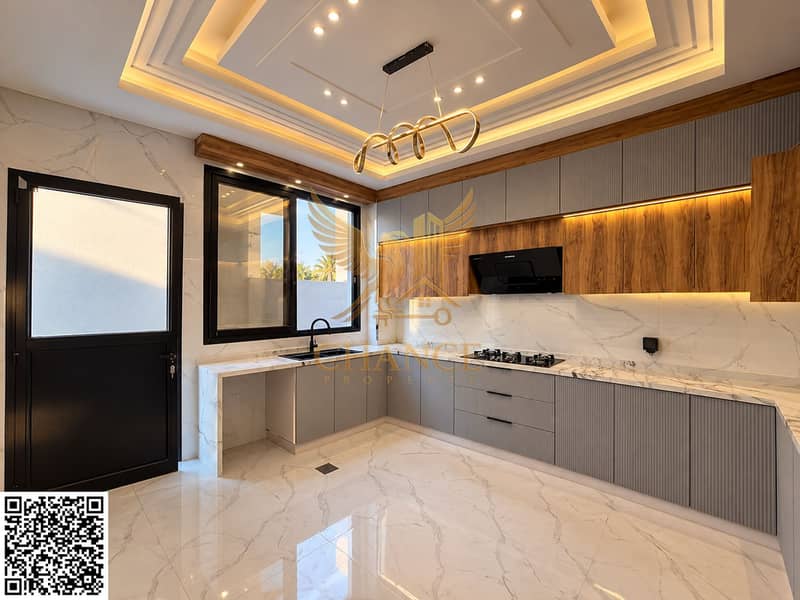 10 Modern Marble Kitchen with Warm Lighting. png