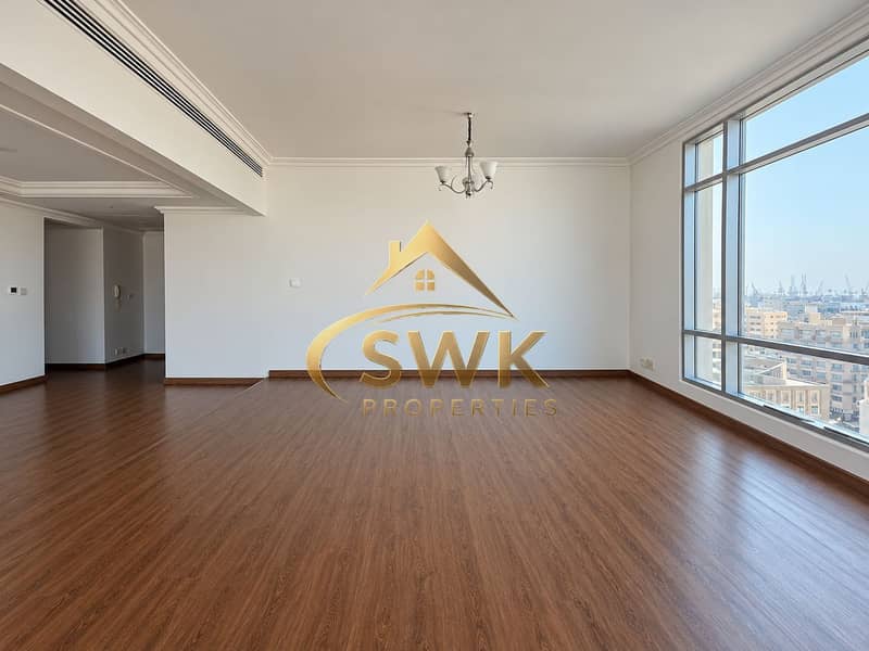 13 Sunlit Empty Apartment with City Views. png