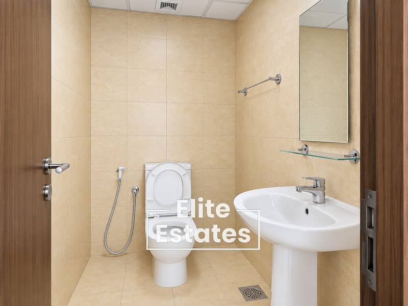 9 Modern Beige-Tiled Bathroom. png