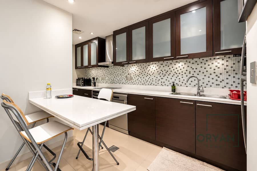 9 Modern Galley Kitchen with Breakfast Bar. png