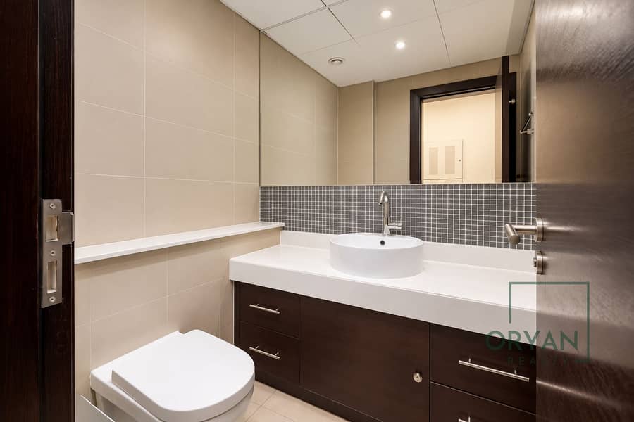 10 Modern Minimalist Beige-Tiled Bathroom. png