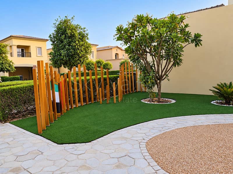 14 Pristine villa street behind wooden fence. png