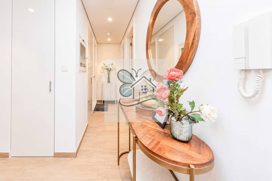 2 wide_well_lit_modern_interior_hallway_foyer_scen. jpg