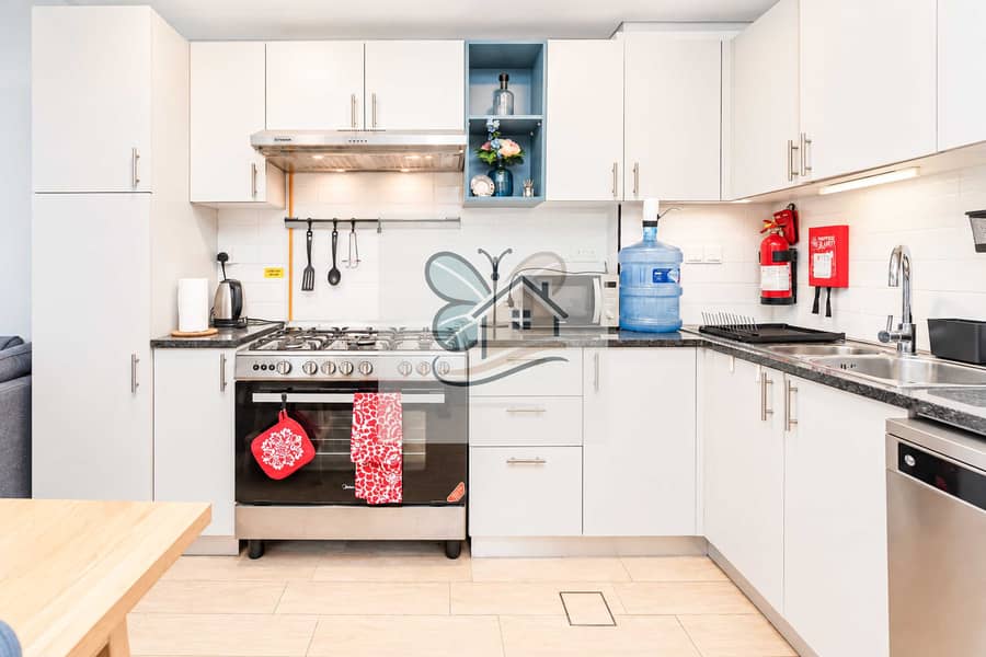 15 wide_clean_well_lit_modern_kitchen_interior_shot. jpg