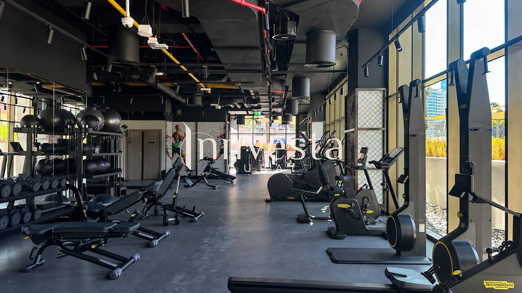 14 Modern gym overlooking a construction skyline-4. png