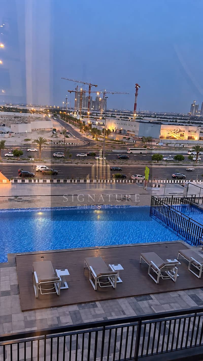 8 Twilight Poolside Skyline Through Glass. png