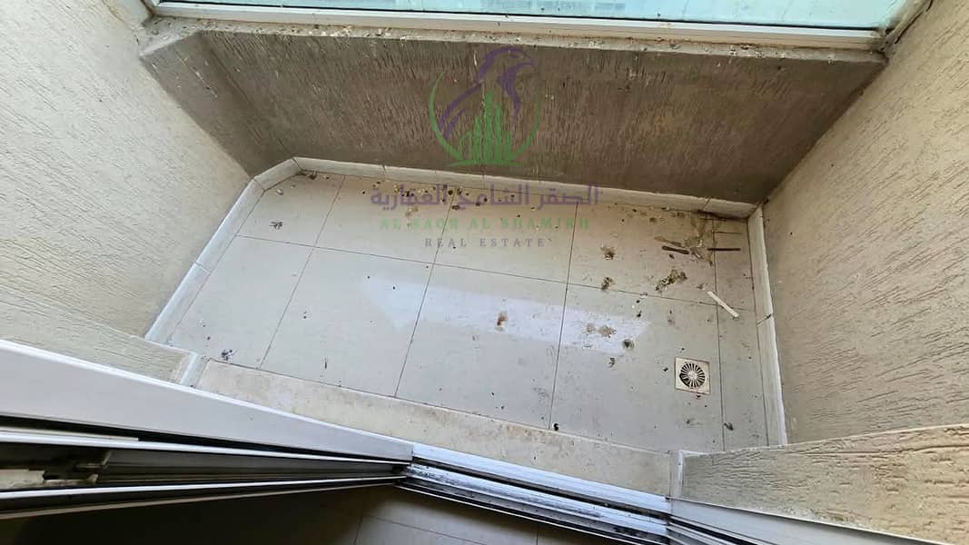9 apartment-for-rent-1-bedroom-altaawn-alsharqh-balcony-12. jpg