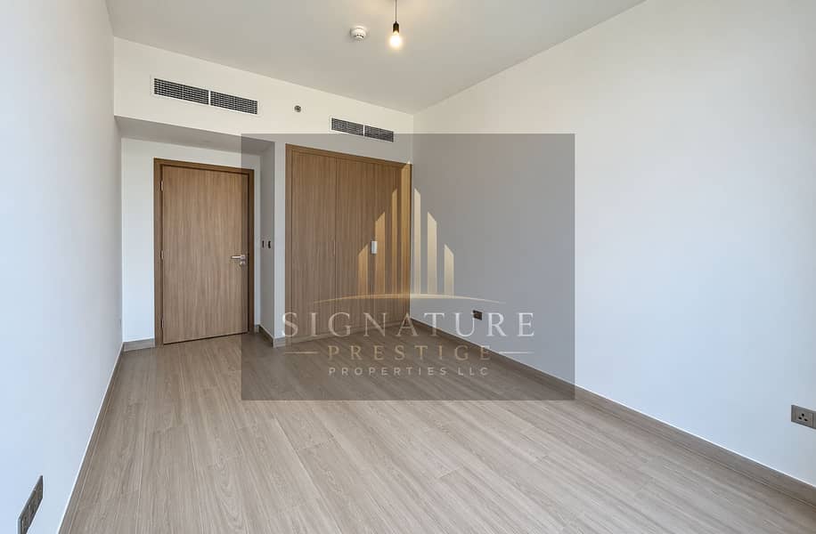 2 Minimalist Empty Bedroom with Warm Lighting. png