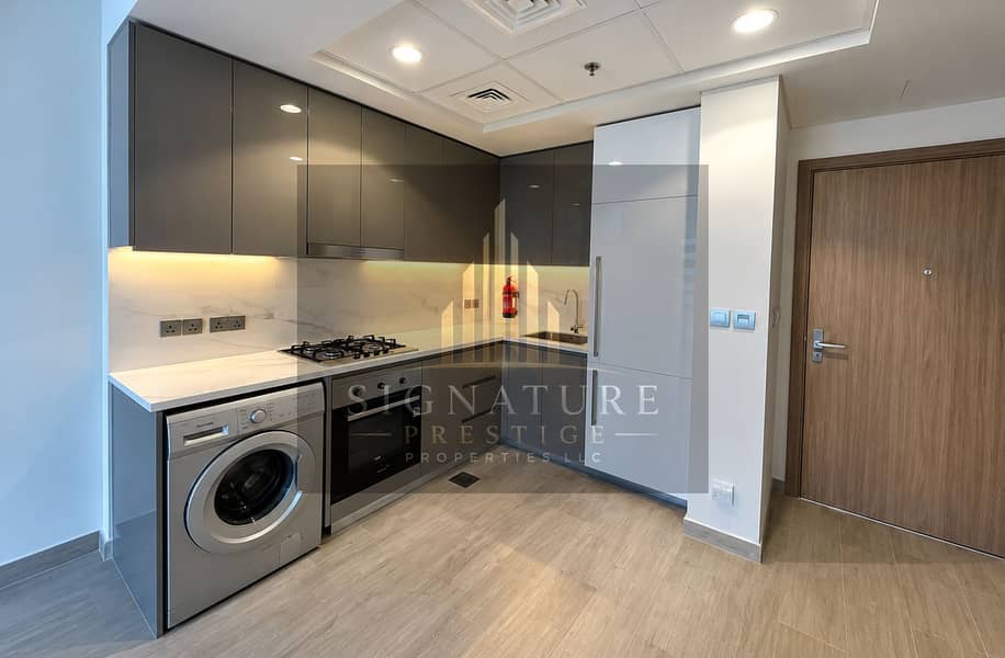 8 Modern L-Shaped Kitchen with Integrated App. png