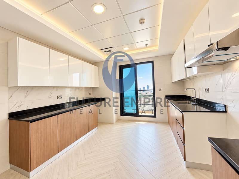 14 Modern Kitchen with City Skyline Views. png