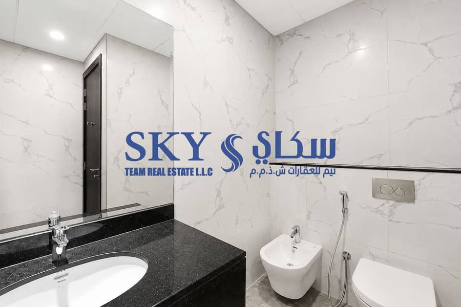 8 Minimalist Marble Bathroom with Modern Fixtures. png