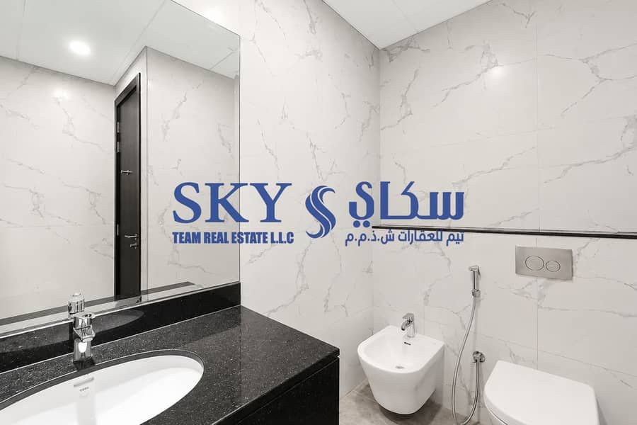 9 Modern Marble Bathroom with Wall-Mounted Fixtures. png