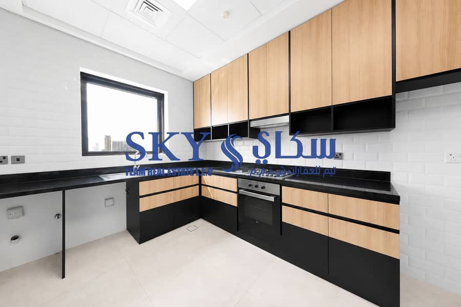 11 Minimalist Black and Wood Kitchen. png