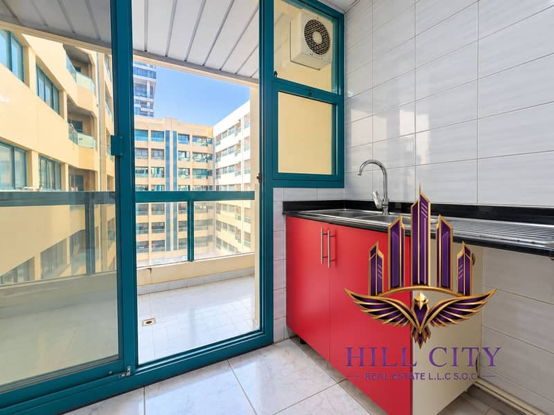 4 Bright Kitchen Opening to Balcony. png