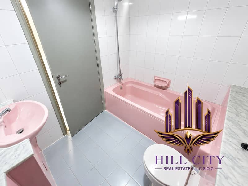 10 Retro Pink-Tiled Bathroom. png