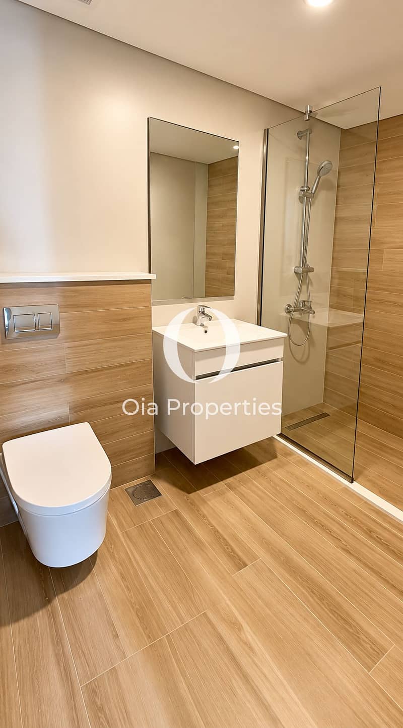 7 Modern Beige Wood-Tile Bathroom. png