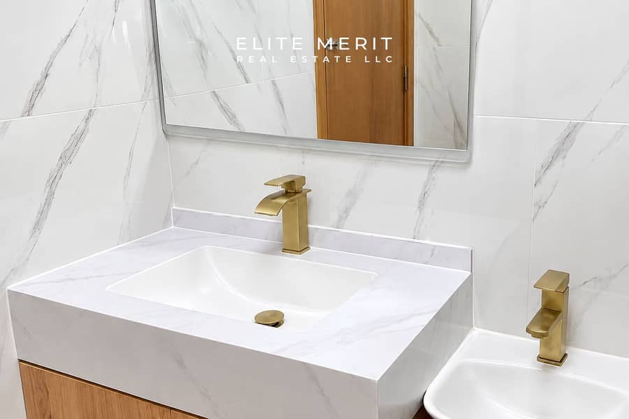 7 Modern Marble Vanity with Brass Fixtures. png