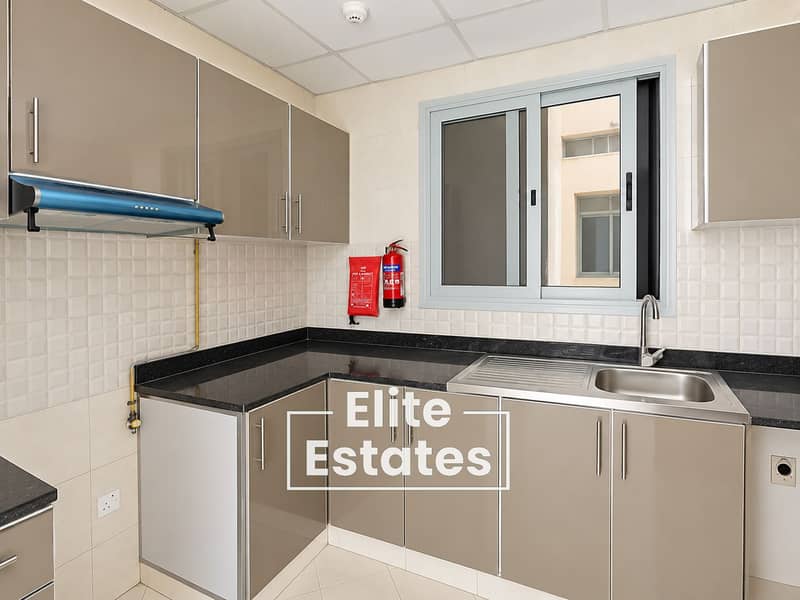 10 Modern Taupe Kitchen with Safety Fixtures. png