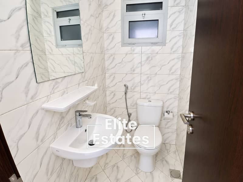 11 Bright Marble-Tiled Bathroom Interior (1). png