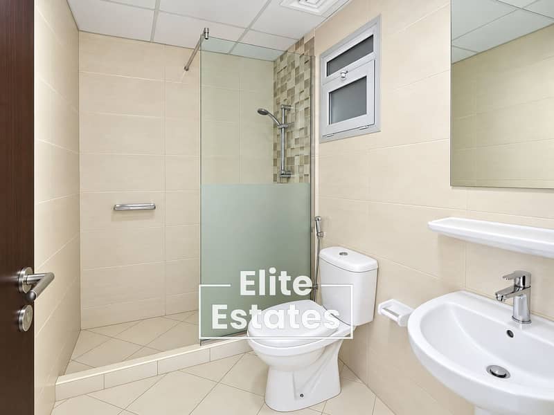 12 Modern Neutral-Tiled Bathroom. png