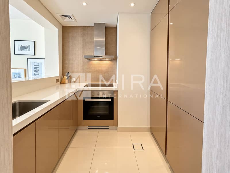 5 Modern Taupe Kitchen with Travel Art