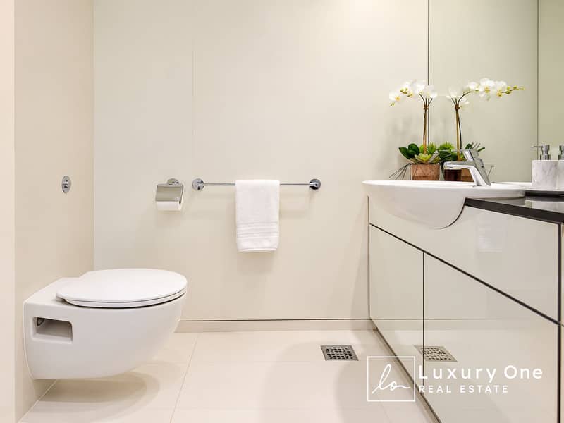 7 Minimalist Luxury Bathroom with Orchids. png