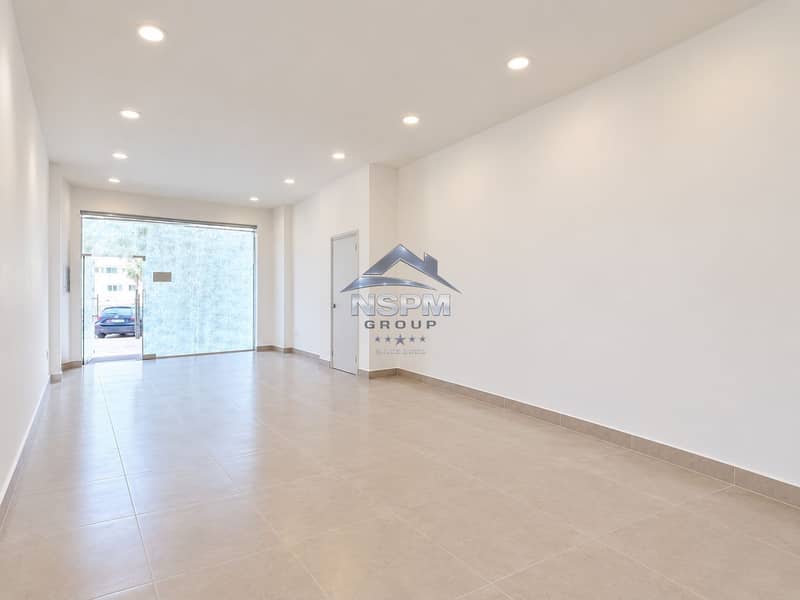 5 Bright Minimalist Retail Interior with Glass Entrance. png