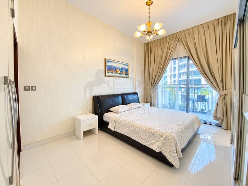 2 Bright Modern Bedroom with Balcony View. png