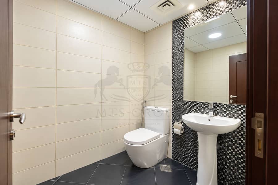 9 Modern Beige-Tiled Bathroom Interior. png