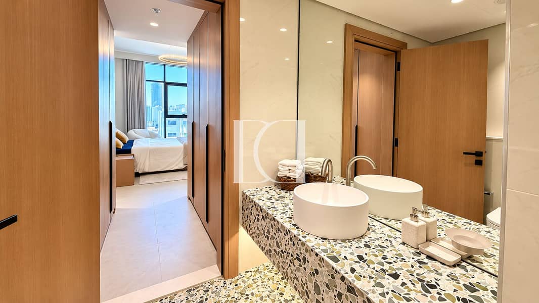 16 Modern Terrazzo Vanity Overlooking City Bedroom. png