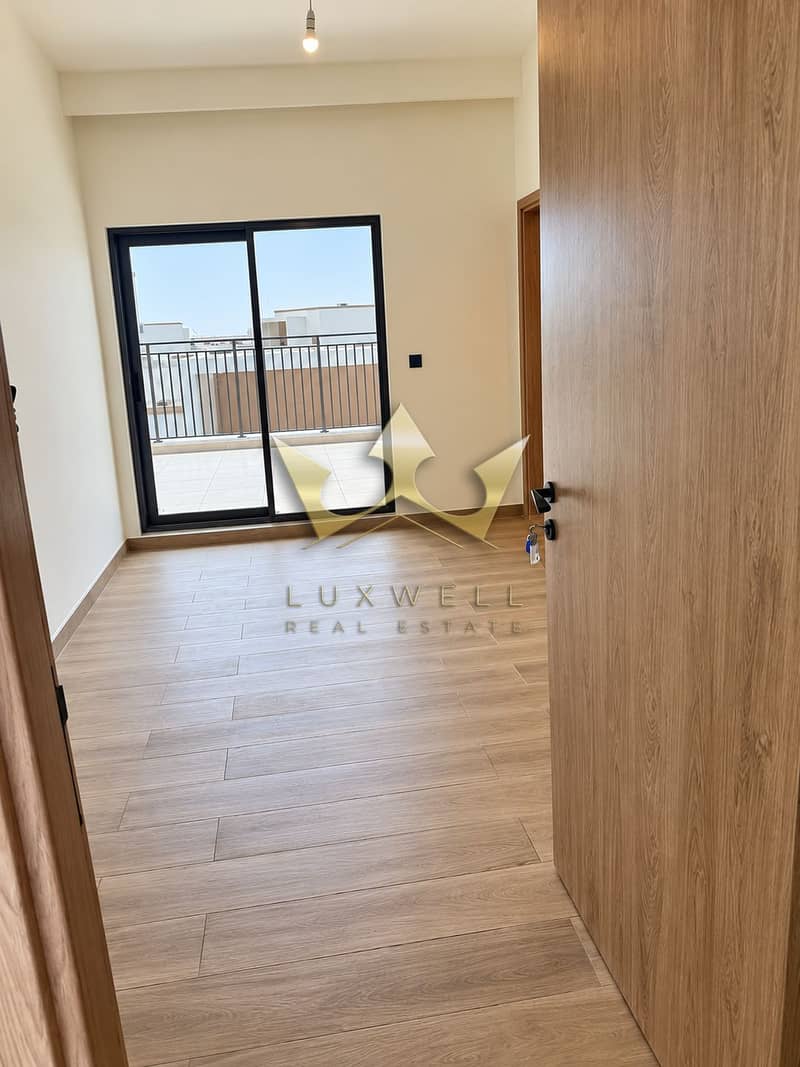 9 Bright Modern Room with Balcony View. png