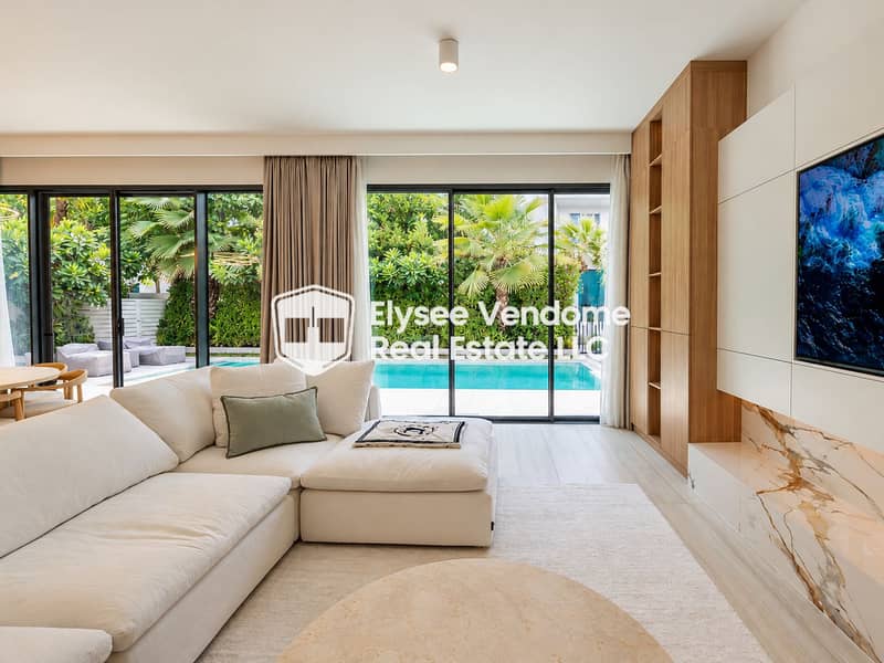 2 Salon minimaliste avec vue sur piscine tropicale. png