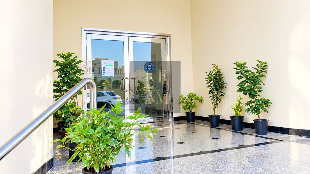 2 Sunlit Modern Lobby with Lush Greenery. png