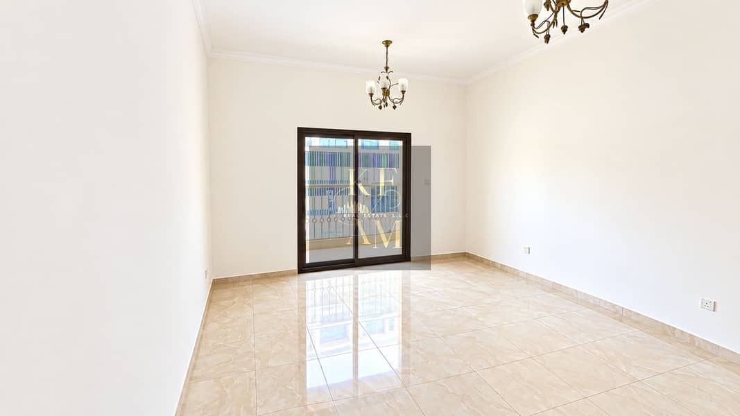 14 Sunlit Empty Room with Balcony Views. png