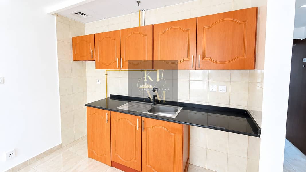 17 Bright Modern Kitchen with Warm Wood Cabinets. png