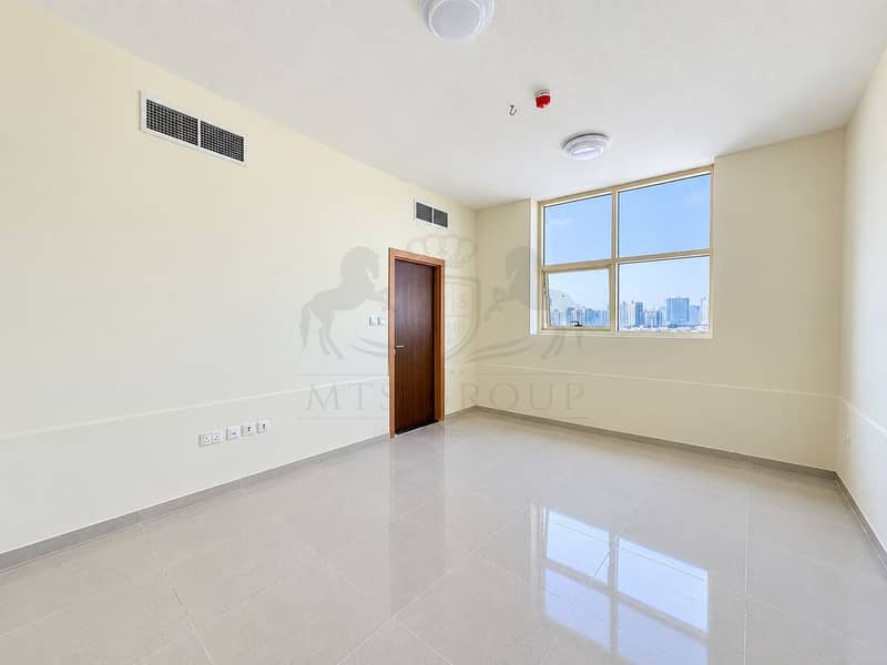 11 Sunlit Minimalist Room with City View. png