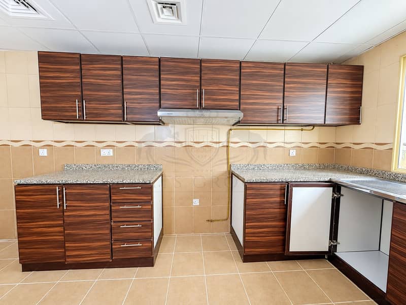 17 Modern Walnut Kitchen with FABER Hood. png