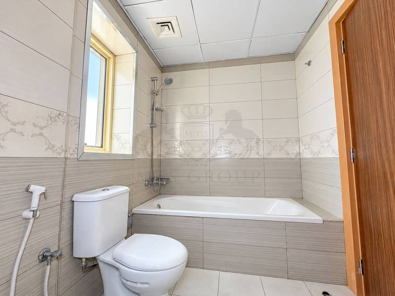 18 Bright Modern Beige-Tiled Bathroom. png
