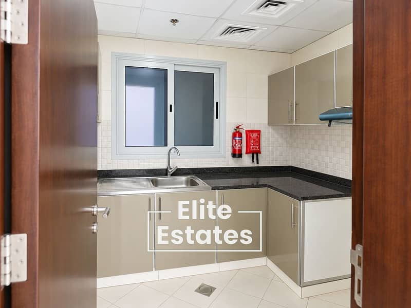 5 Compact Kitchen Through Open Door. png