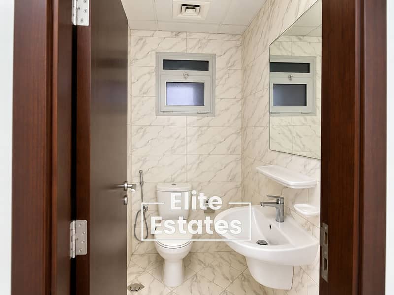 6 Compact Marble-Tiled Bathroom Interior. png