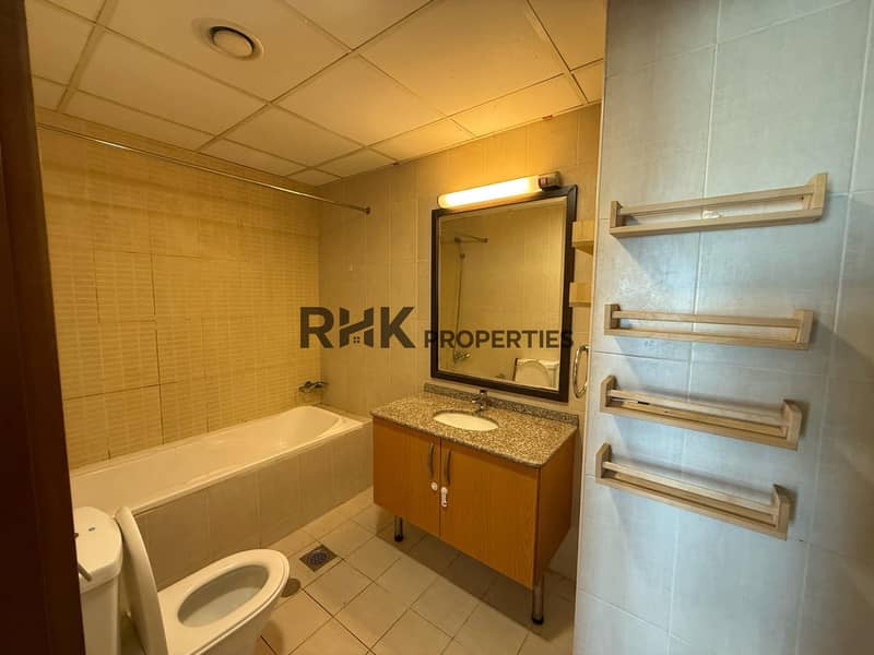 7 Bathroom with a bathtub, a mirrored vanity, a bidet and a wall-mounted towel rack.