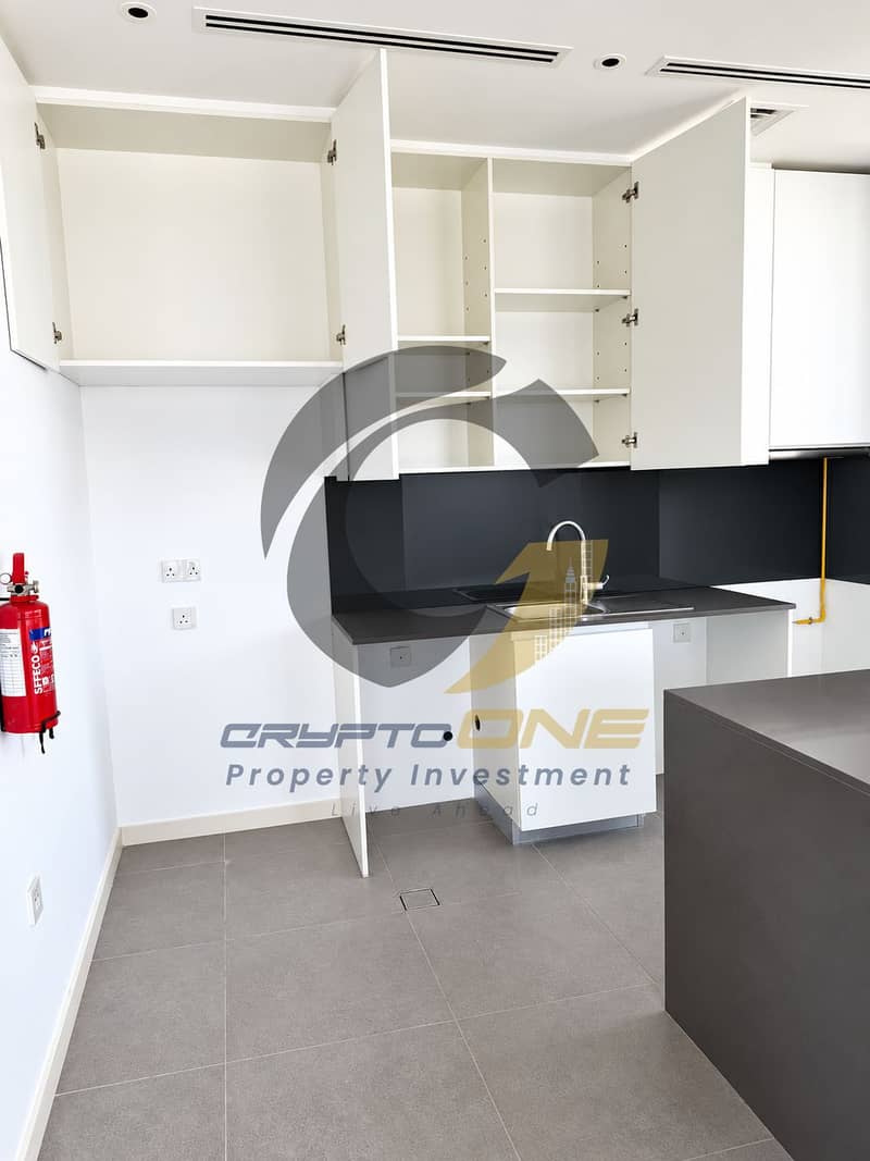 6 02_bright_minimalist_kitchen_with_open_cabinets. png