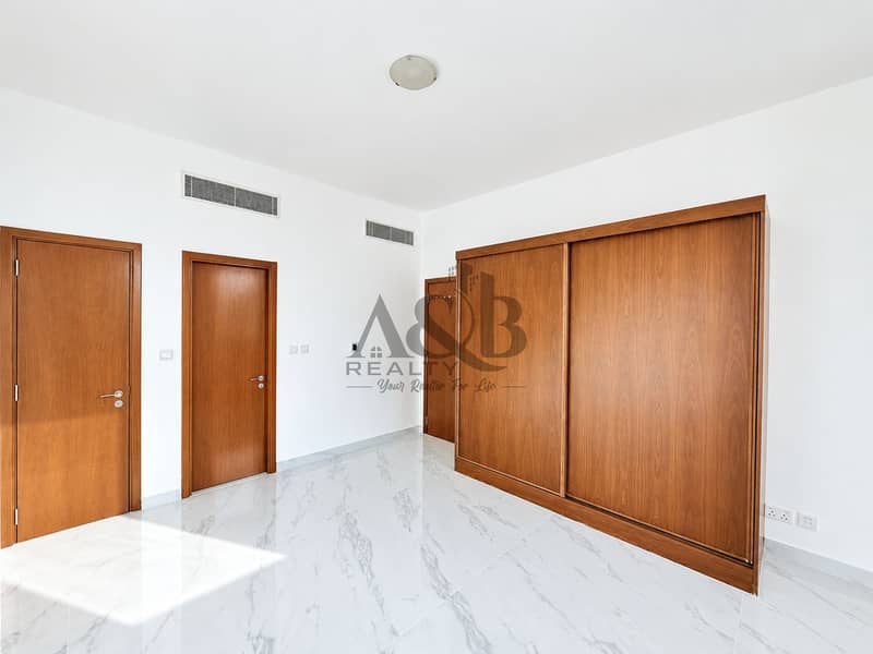 9 Minimalist Marble-Floored Room with Wooden Wardrobe. png