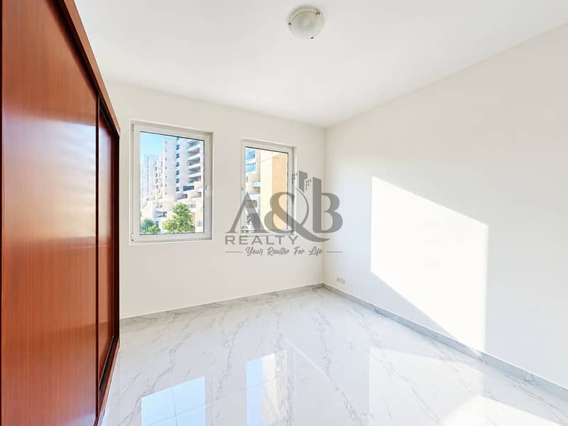 10 Minimalist Sunlit Room with Wooden Wardrobe. png