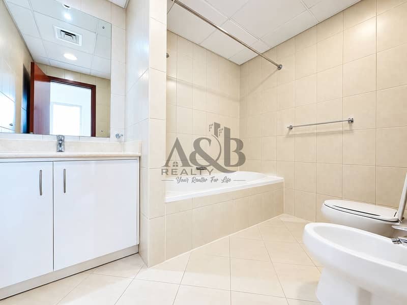 11 Bright Minimalist Beige-Tiled Bathroom. png