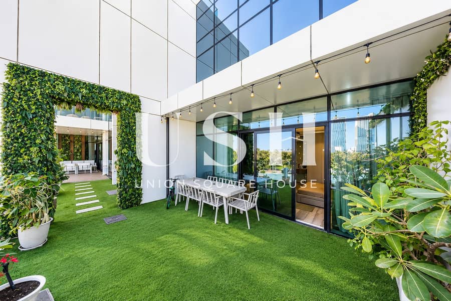 4 Modern Green Courtyard with Glass Facade. png
