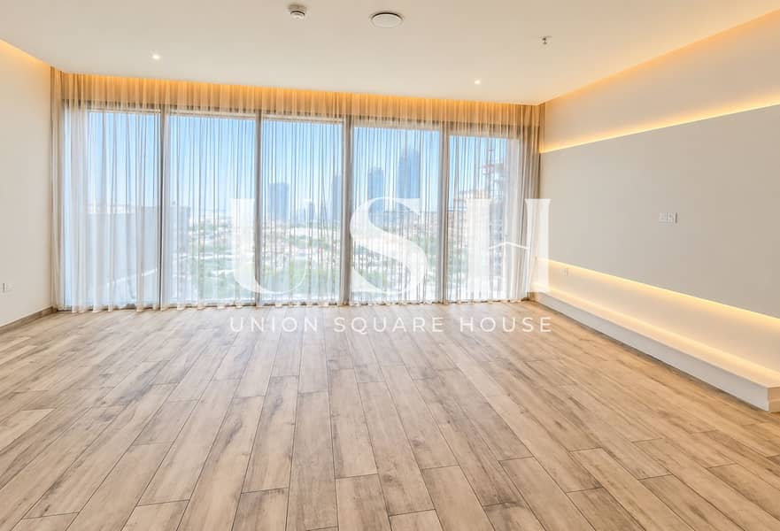 3 Sunlit Minimalist Room Overlooking Cityscape. png