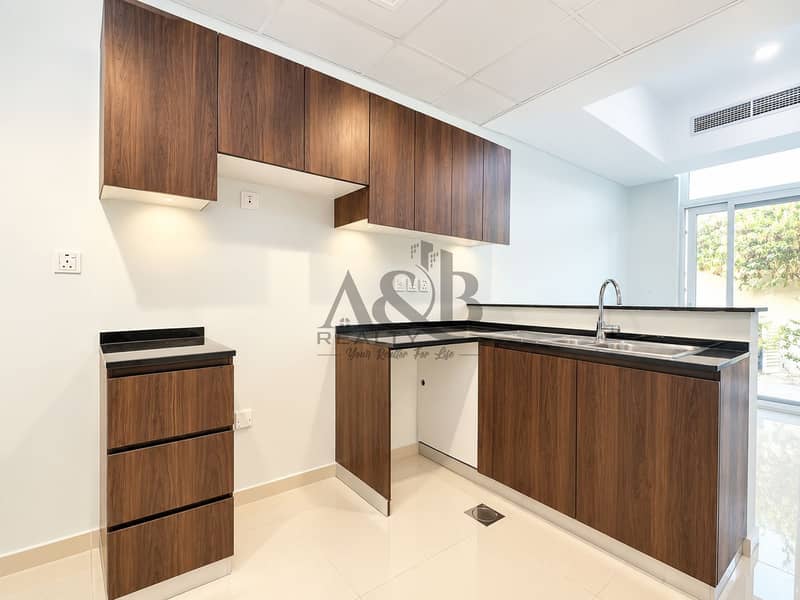 6 Modern Walnut Kitchen with Black Countertops. png